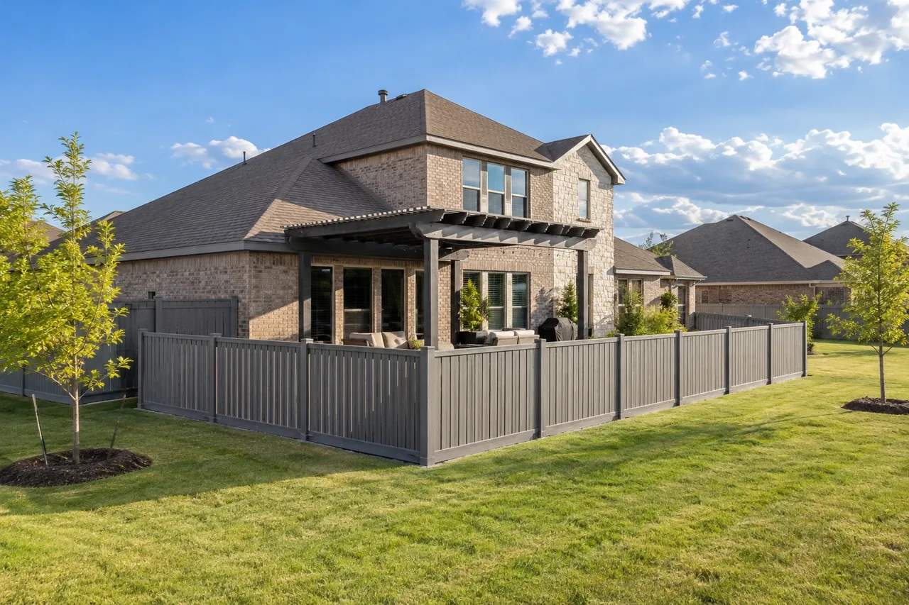 Gray semi-privacy vinyl fence around an Amarillo patio
