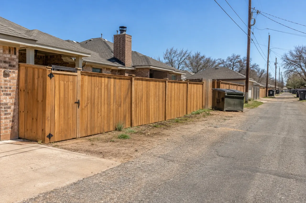 Cedar fence with an alley gate behind an Amarillo home